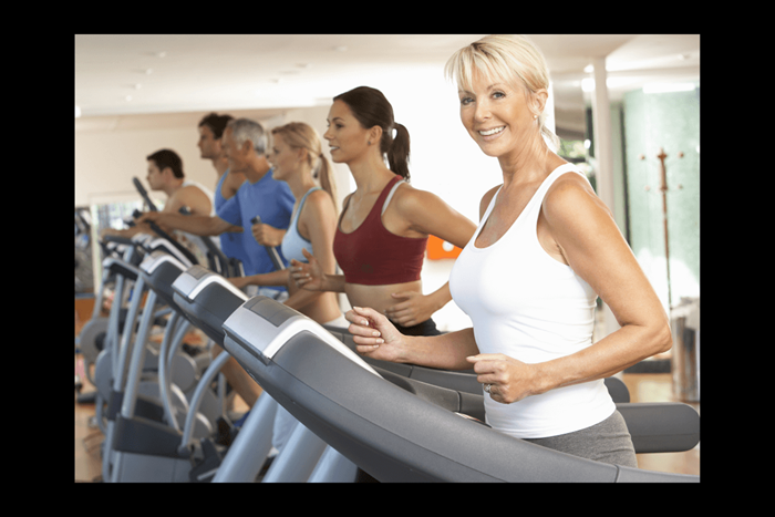 Technogym Excite Run 900 - Women running + Treadmill (1).png